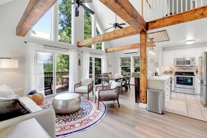 Stunning floor-to-ceiling windows in the living room with plenty of comfortable seating.
