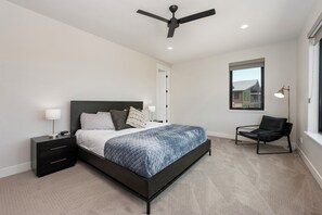 Master suite with king bed, ensuite bathroom, walk-in closet, and spacious views