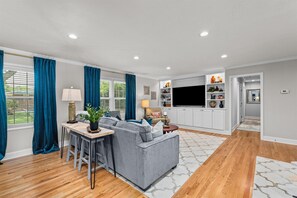 Living room with 60 inch smart TV.