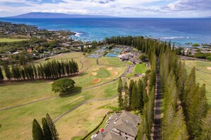 Breathtaking views of the Kapalua Golf Course and Pacific Ocean from this serene vacation spot, perfect for relaxation or adventure.