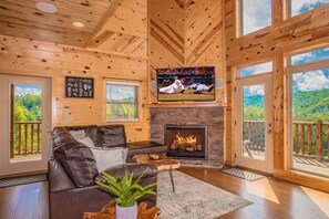 Den with 65" TV and gas fireplace