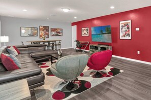 Vibrant Upstairs TV Lounge Area with Large Smart TV Perfect for Family Gatherings!