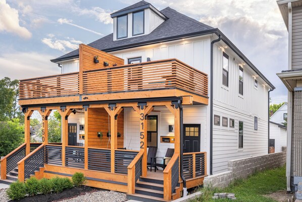 Custom front façade with two-story terrace. Guests have access to the right side unit of the duplex.