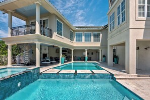 WELCOME TO VILLA BELLISSIMO - A luxurious three-story villa offers private amenities, a private pool and spa, and elegant interiors that blend comfort with coastal charm.