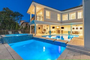 WELCOME TO VILLA BELLISSIMO - A luxurious three-story villa offers private amenities, a private pool and spa, and elegant interiors that blend comfort with coastal charm.