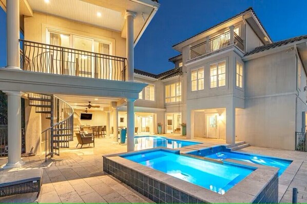 WELCOME TO VILLA BELLISSIMO - A luxurious three-story villa offers private amenities, a private pool and spa, and elegant interiors that blend comfort with coastal charm.