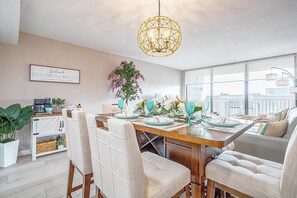 Elegant dining area with a contemporary chandelier and seating for six