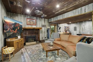Lower Level Game Room with Large TV, Shuffleboard Table, Darts, and Bar