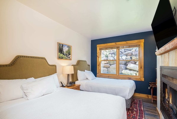 Main Room: 2 full beds, gas fireplace, 50” TV, kitchenette
