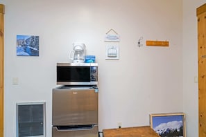 Main Room: 2 full beds, gas fireplace, 50” TV, kitchenette