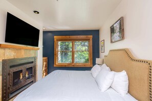 Bedroom 1: King bed, gas fireplace, 50” TV, 2 closets, en-suite bath