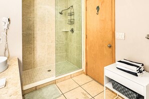 Start your day off right in our spacious bathroom, equipped with dual sinks for added convenience and a huge shower for a refreshing retreat.