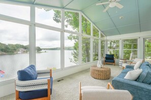 Breathtaking lake views from the sunroom—your perfect spot for morning coffee or a good book.