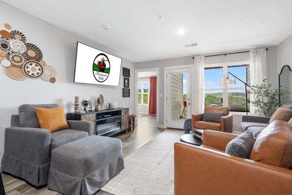 Living Area with Cable TV, Electric Fireplace, and Deck Access
