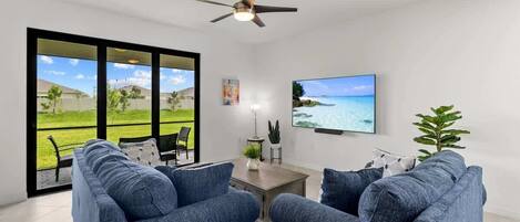 "Cozy Living Room with Scenic Backyard Views"