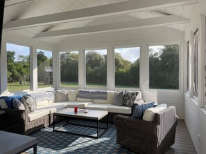 screened in porch with TV 