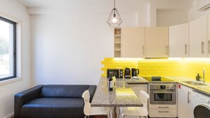 Discover the charm of our living area, adorned with unique accents and comfortable seating. A welcoming space to connect, unwind, and create lasting memories #compact #modern