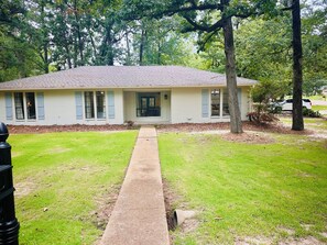 Exterior of home in beautiful quiet neighborhood across from reservoir.