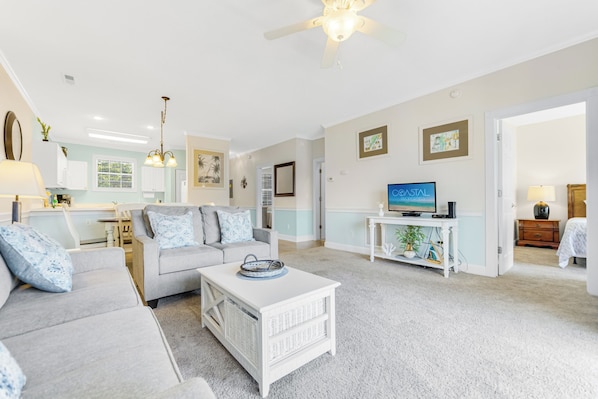 Relax in a cozy and inviting living space, perfect for unwinding after a day at the beach.