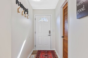 Entryway and entrance to Laundry Room