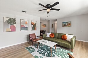The living room couch converts to a full sleeper sofa with provided bedding.