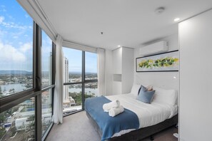 The Studio room offers air-conditioning and a comfortable queen bed. It features floor-to-ceiling windows, allowing ample natural light and providing stunning 180-degree views.