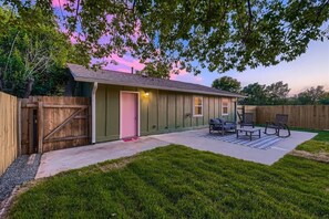 Well-maintained backyard with a variety of trees and shrubs for a natural, private setting.