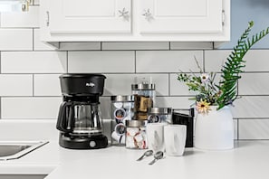 Enjoy your fully stocked coffee bar with regular and decaf coffee, filters.