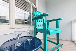 Relax on the front patio with high-top seating, perfect for coffee and drinks