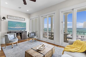 Living Room with comfortable seating, Gulf views, 65” Smart TV