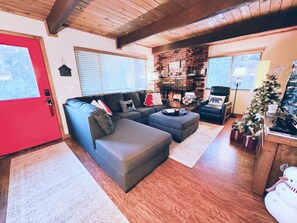 Comfy living room with new furniture, wood burning fireplace, Flat TV w/Apple Tv