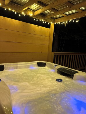 Beautiful hot tub with night time lights!