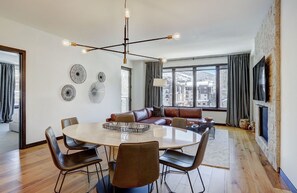 Elegant dining area with seating for six, ideal for family meals or entertaining guests, with plenty of natural light.