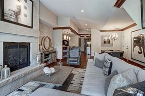 Cozy living room with a fireplace and plush seating.