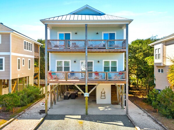 Enjoy ocean breezes from the two front decks or gather on the patio beneath the house for dinner off the grill, cornhole or sharing stories and memories.