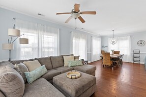 Enjoy lounging on the comfortable couch after a day at the beach.