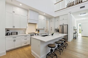 Our beautiful kitchen boasts modern stainless steel appliances, making cooking a breeze in style