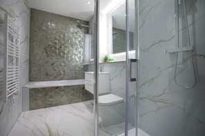 Bathroom with bathtub and separate shower