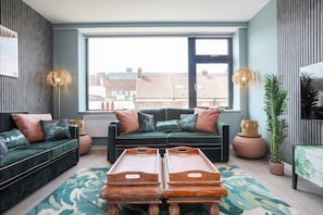 Integrated living and kitchen spaces in an open layout.