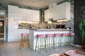 Integrated living and kitchen spaces in an open layout.