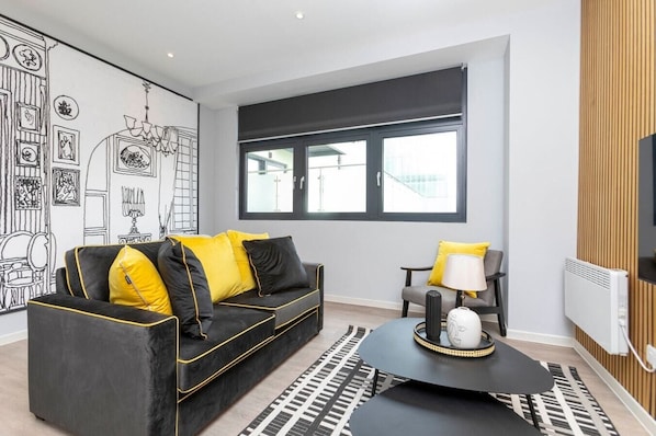 Integrated open-layout living room and bedroom space.