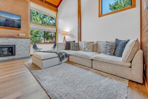 Living Room: Oversized couch, 55” TV, gas fireplace