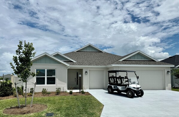 House Front with 4 Seater, Electric Golf Cart included!