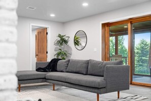 Enjoy the cozy ambiance of a modern living room with scenic views.