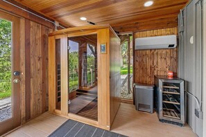 Indulge in a luxurious sauna experience with beautiful garden views.