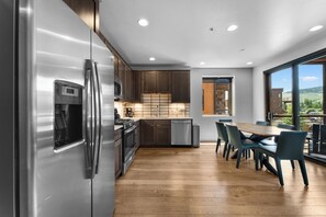 Full updated kitchen with stainless steel appliances.