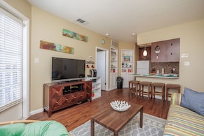 Slow down and savor the moment in this cozy living and kitchen area, designed for relaxation and comfort