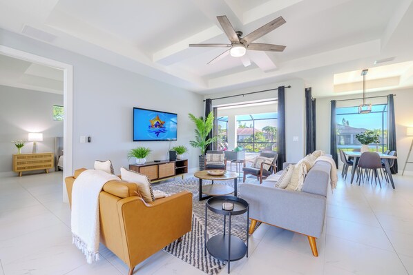 Modern Elegance - - Bright, open living space with stylish seating & sleek furniture, perfect for relaxation or entertaining
- Large windows & sliding doors provide abundant natural light &  outdoor views
- Neutral tones & modern décor create a chic, inviting atmosphere
