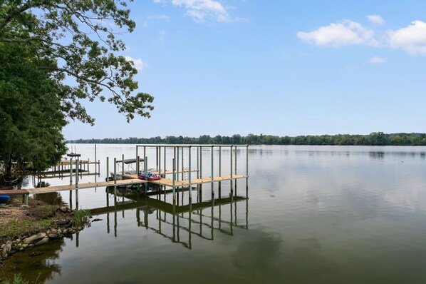 boat dock just steps from back yard