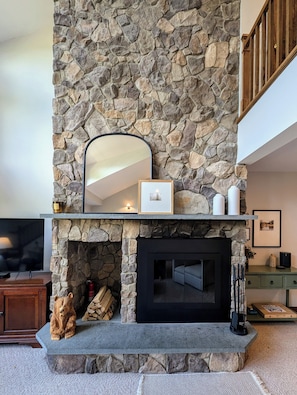 The wood burning fireplace is perfect to cozy up after a day on the slopes.
